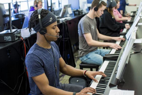 a man playing a piano